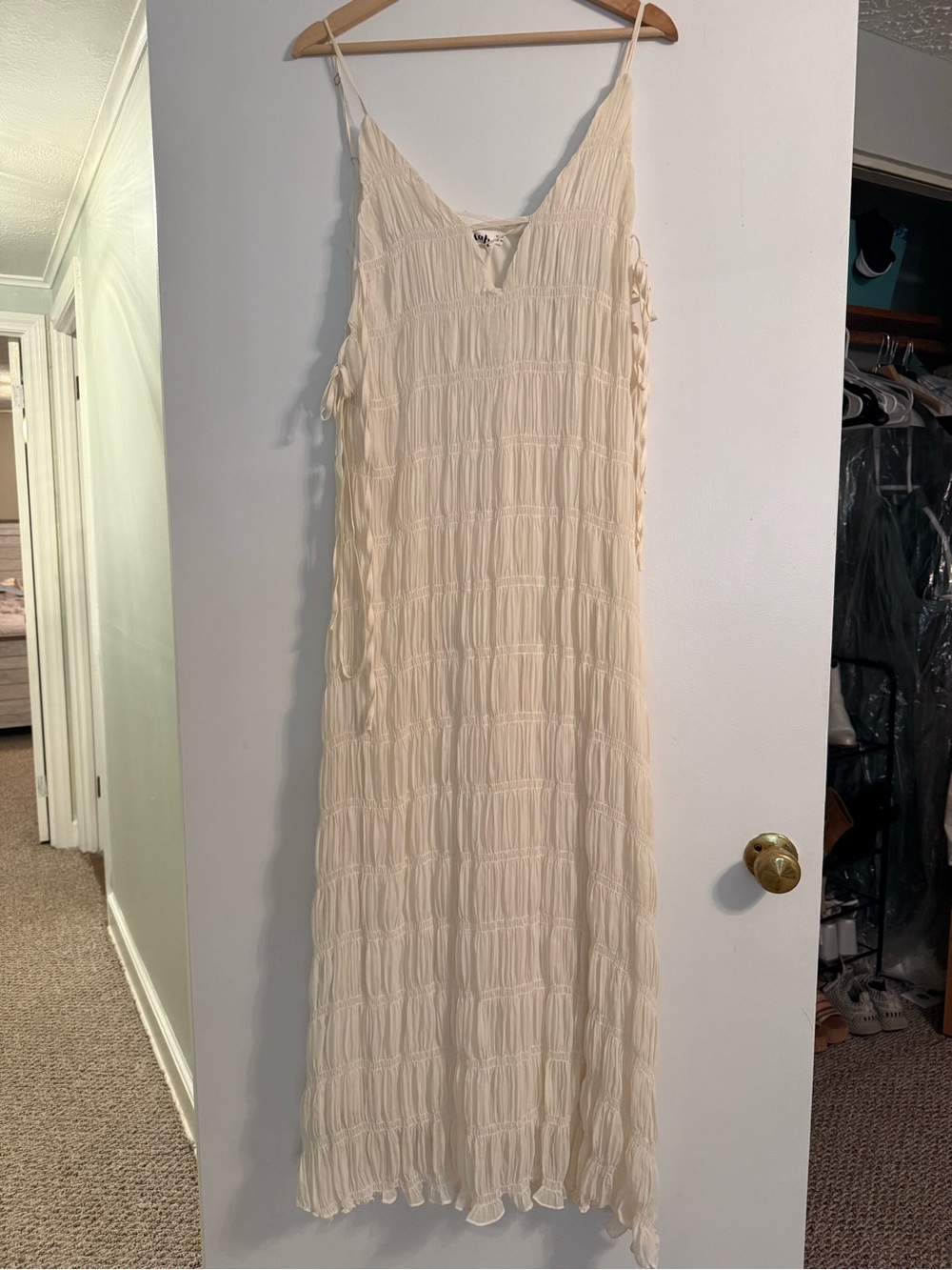 Ivory Sleeveless Smocked Maxi Dress with Adjustable Side Ties
